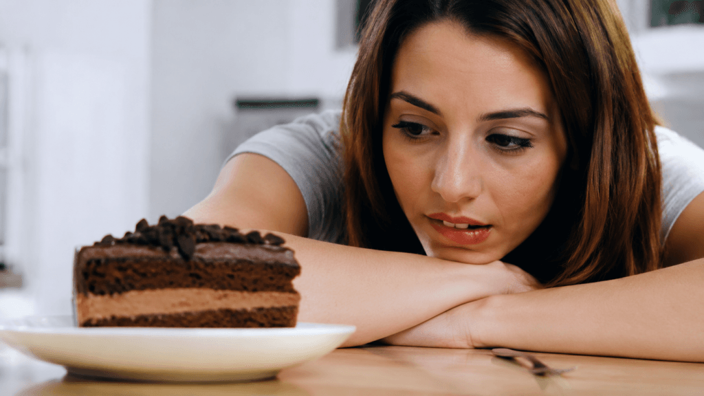 Pessoa lidando com a fome emocional e ansiedade por doces
