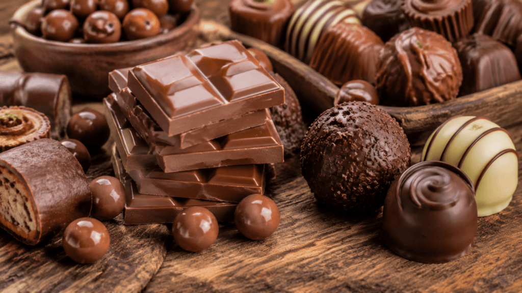 Barra de chocolate ao leite e doces que atrapalham o emagrecimento antes de dormir.